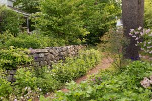 Stone wall and a path through the gardens
